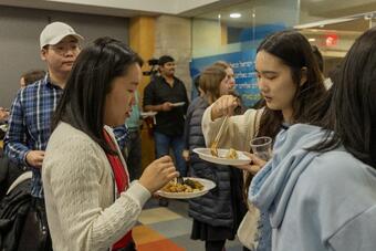 Students enjoy food and conversation.