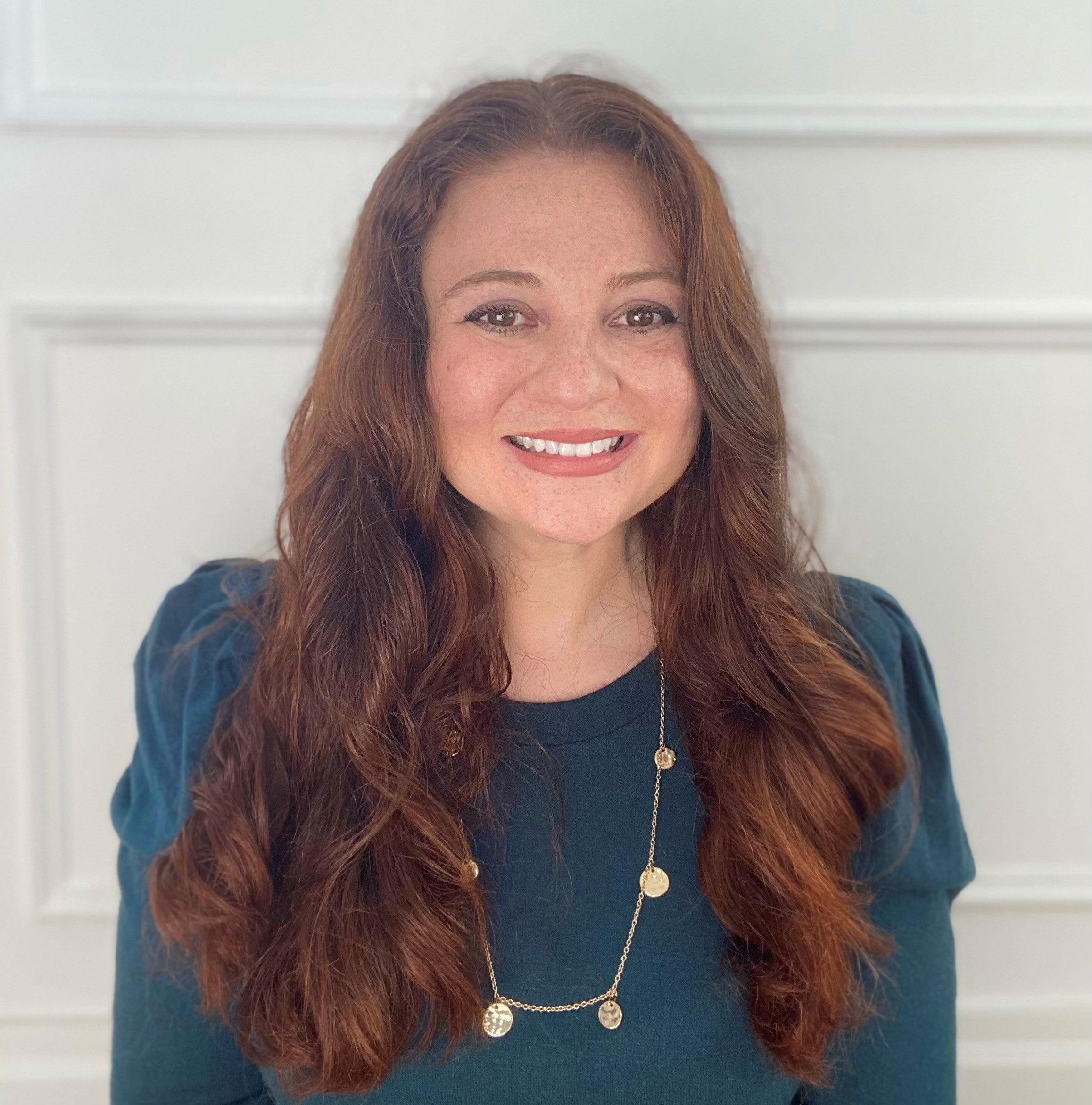 Director of Fieldwork Education's headshot, auburn haired professional woman in blue shirt