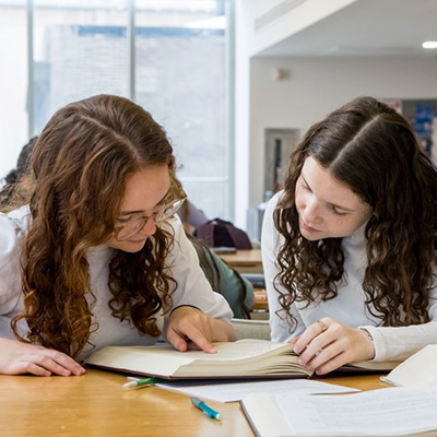 Two female students studying