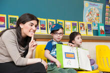 Teacher in classroom with small children