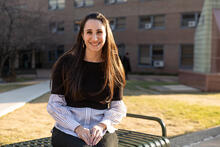 Smiling female student on bench