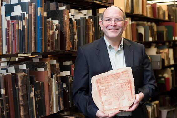 Dr. Steven Fine with ancient biblical tombstone