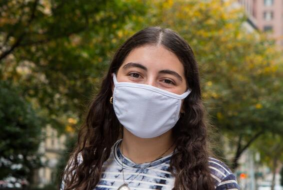 Stern College student in mask outside