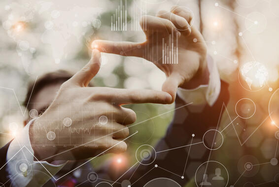 Businessman framing distant sun rays, visual interfaces effects