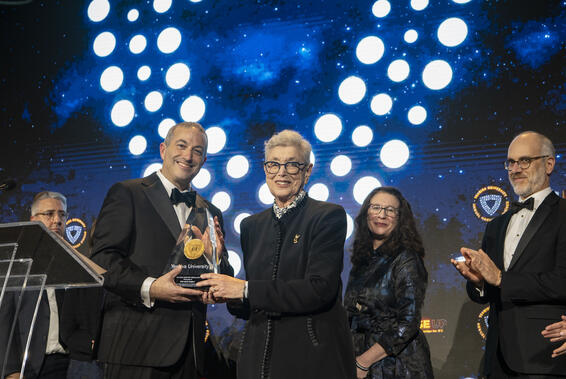 Rabbi Dr. Ari Berman presents the Katz family with the Second Century Medallion at YU's 101st Hanukkah Dinner.