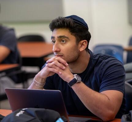 Male orthodox student in class