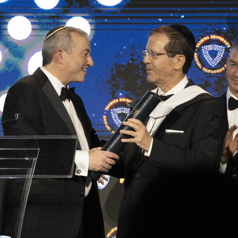 President of Israel, Isaac Herzog, being presented with an honorary doctorate by Rabbi Dr. Ari Berman, president of Yeshiva University, at the university's 101st annual Hanukkah Dinner on Dec. 7, 2025.