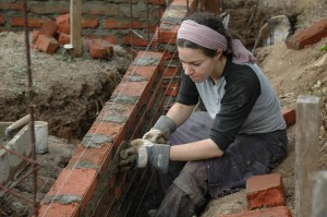 Laying bricks for library's foundation in Nicaragua.