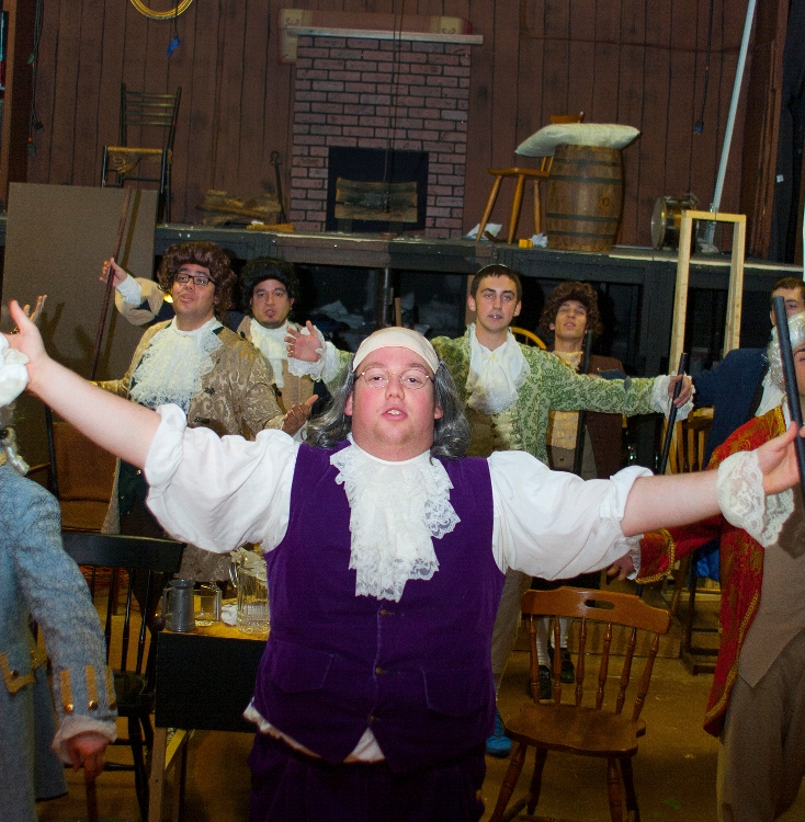 The cast of 1776 rehearses a musical number.