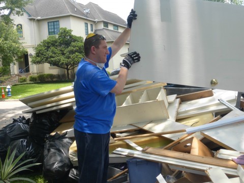 Student Daniel Geller disposes of debris