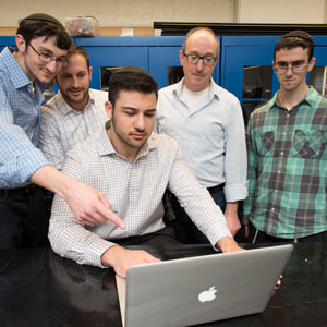 Daniel Lazarev (at computer) with Dr. Fredy Zypman (second from right) and fellow students.