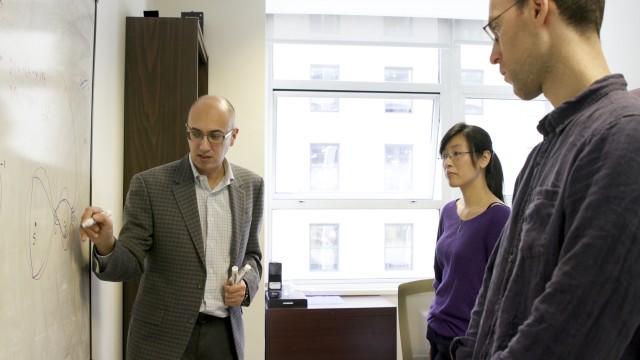 Dr. Marian Gidea, left, with doctoral students Wai-Ting Lam and Maxwell Musser