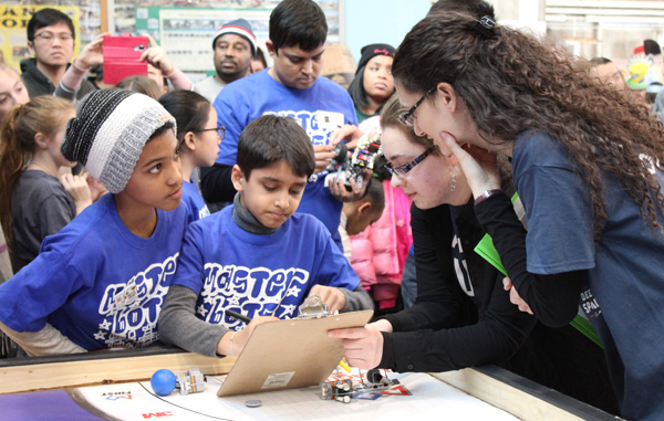 FIRST Robotics Competition - Referees working with children