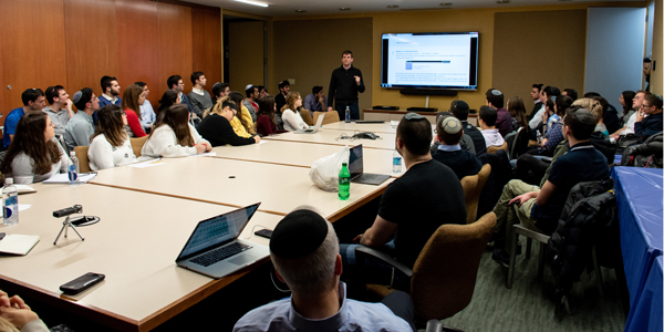 Michael Eisenberg speaks to a full audience