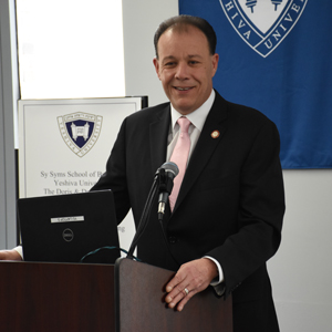 Mark Gjoanj at lectern