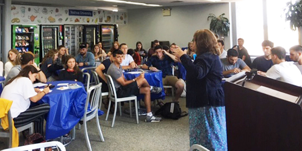 Rona Novick talks to EIN Prat students