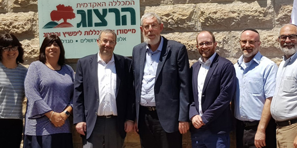 (l-r): Dr. Deena Rabinovich, chair of Jewish Studies at Stern College; Stephanie Strauss, executive director of YU in Israel; Dr. Ari Berman, President of YU; Rabbi Dr. Yehuda Brandes, the head of Herzog College; Rabbi Dr. Stu Halpern; Yehuda Aronson; Rabbi Dr. Shalom Berger