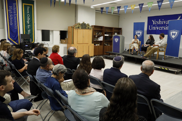 Audience at event facing Weiss, Meir, Leibovitz