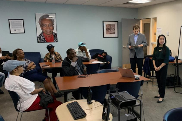 Bet Tzedek Pop-up Clinic: student speaking to assembled audience