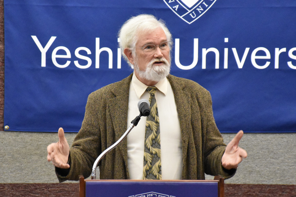 Dr. William Lee at the lectern speaking