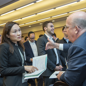 Laurence Grafstein speaks with a student