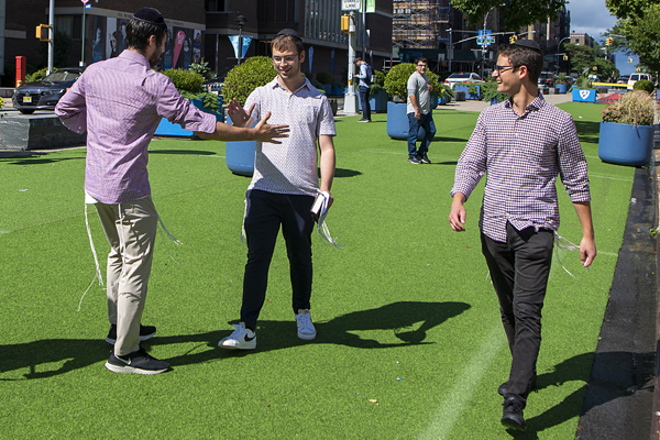 Three men on the Wilf Campus