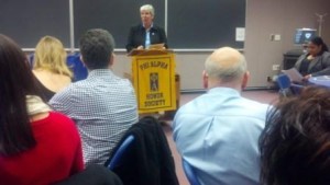 Dean Carmen Ortiz Hendricks (center) and Chapter Advisor Laura Gooch (right) congratulate the inductees and their families