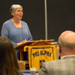 Dean Carmen Hendricks congratulates Phi Alpha inductees